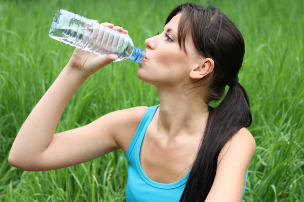 woman-drinking-water-outside